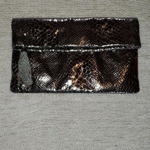 Gunmetal snakeskin clutch